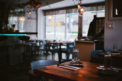 Empty chairs and table in restaurant