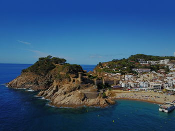 Scenic view of sea against blue sky