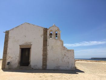 Low angle view of church against blue sky