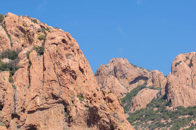 Scenic view of rocky mountains against clear blue sky