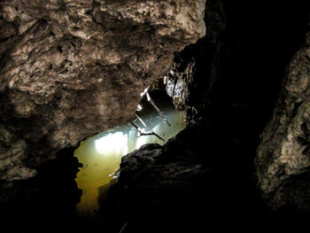Close-up of illuminated lighting equipment in cave