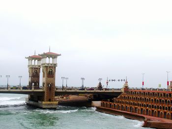 View of pier in sea against clear sky