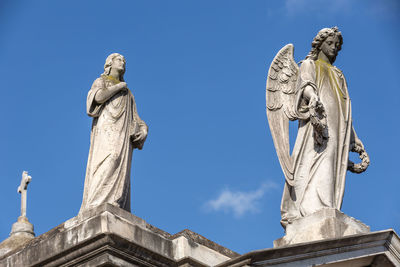 Low angle view of statue against sky