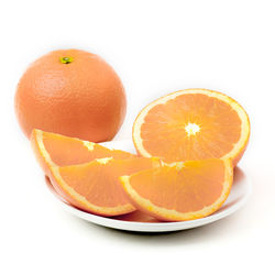 Close-up of orange fruit against white background