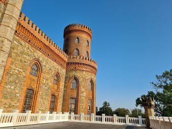 Low angle view of historical building against blue sky