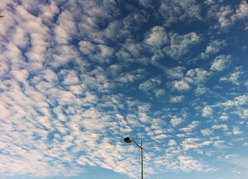 Low angle view of street lamp against sky