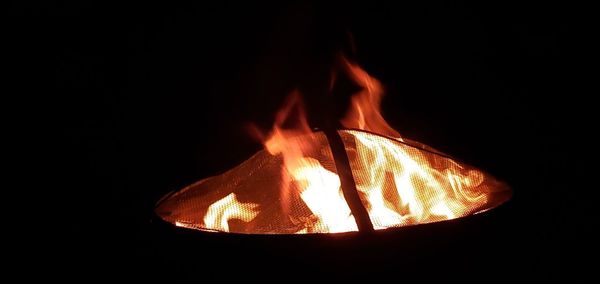 Close-up of bonfire against black background