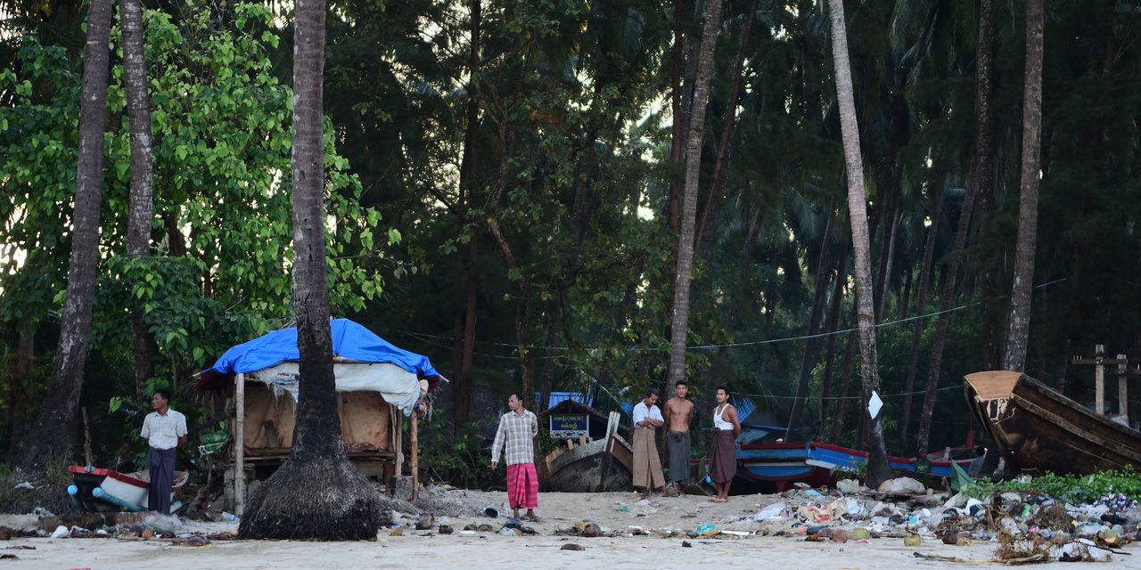 PEOPLE IN FRONT OF TREES