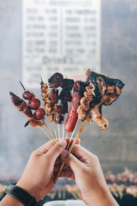 Close-up of hand holding ice cream