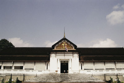 Facade of old building against sky