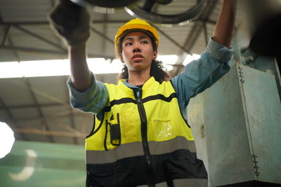 Portrait of young woman standing in gym