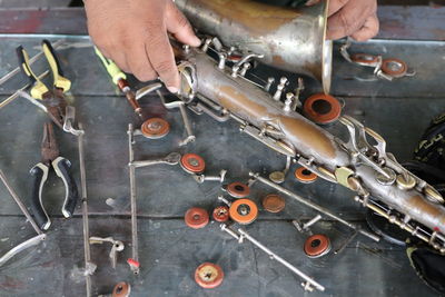 Midsection of man working in machine