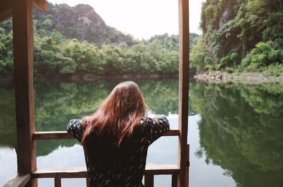 Rear view of woman looking at waterfall