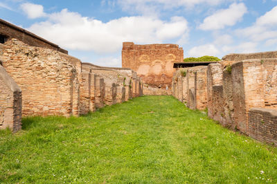 View of old ruin building against cloudy sky