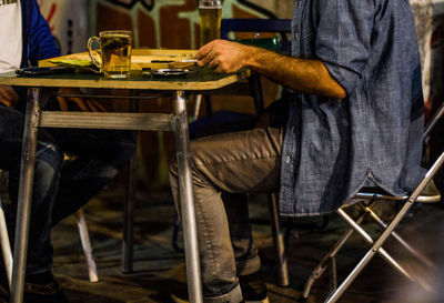 Man sitting on chair in cafe