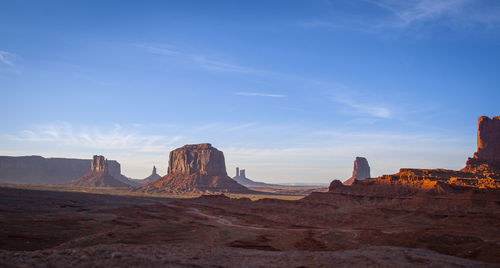 Rock formations on landscape against sky