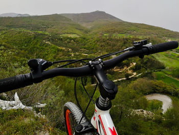 Man riding bicycle on mountain road