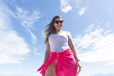 A woman on top of a boat against the sea in the background. salvador, bahia, brazil.