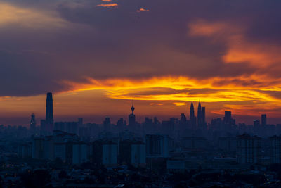 Cityscape against sky during sunset