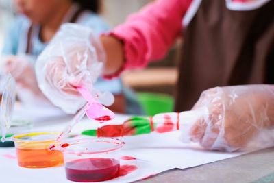 Midsection of doctor examining patient in laboratory