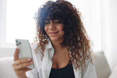 Young woman using mobile phone