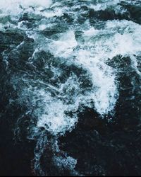 View of waves splashing on rocks