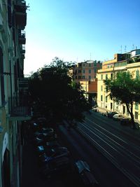 Buildings in city against clear sky