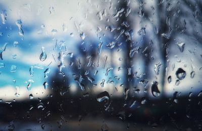 Full frame shot of wet glass window in rainy season