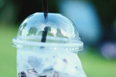 Close-up of glass bottle against blurred background