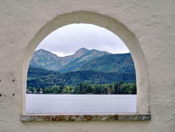 Scenic view of mountains seen through window