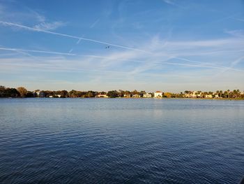 Scenic view of lake against blue sky