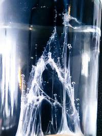 Close-up of water splashing in container