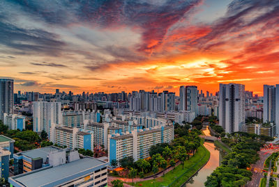 High angle view of buildings against sky during sunset