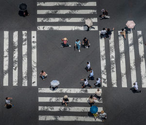 High angle view of people walking on road