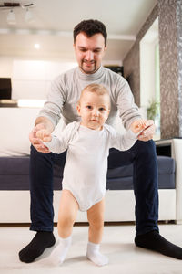 Portrait of son with father at home