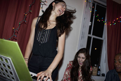 Young woman playing a keyboard