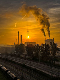 High angle view of buildings against sky during sunset