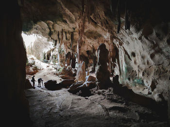 Panoramic view of people in cave