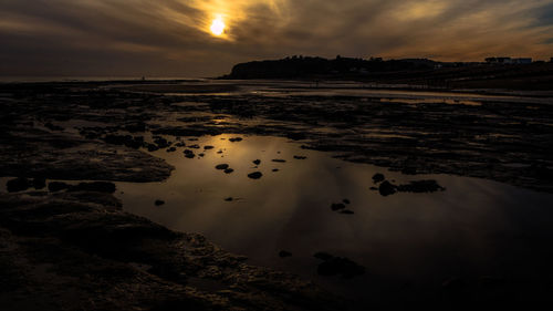 Scenic view of sea against sky at sunset