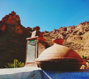 View of rock formation against clear blue sky