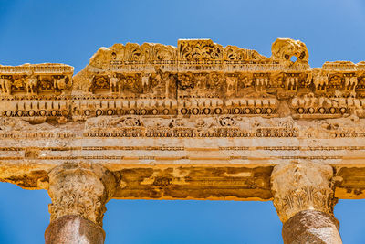 Low angle view of old ruins against clear sky