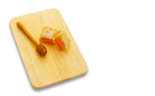 High angle view of pencil on cutting board against white background