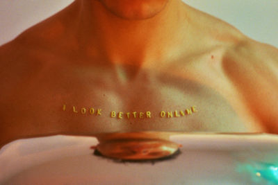 Close-up of shirtless woman