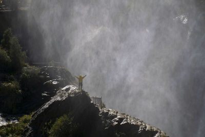 High angle view of man standing on mountain