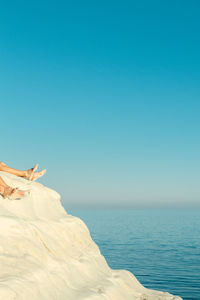 Scenic view of sea against clear blue sky