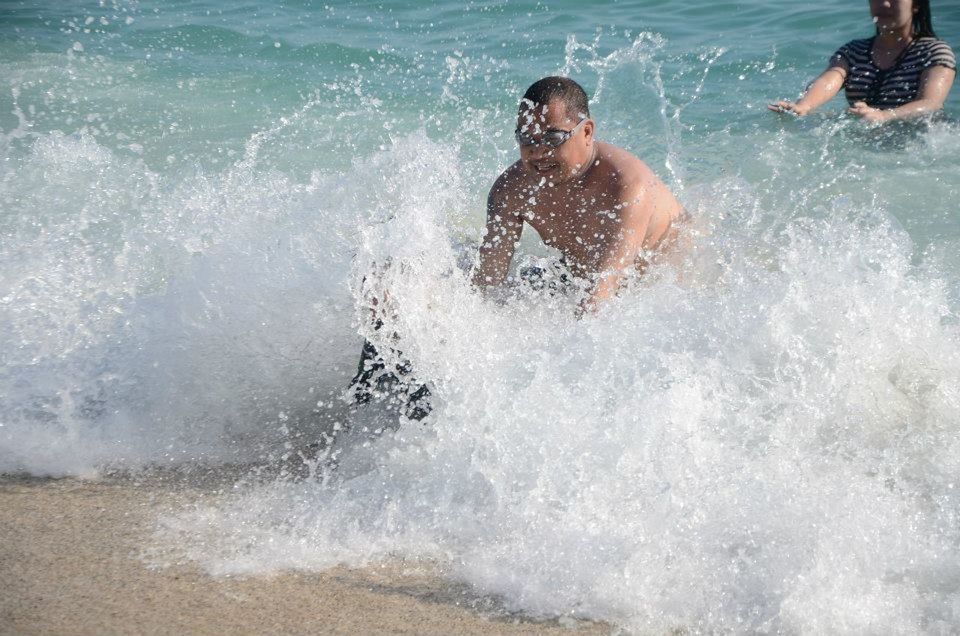 MAN SURFING IN SEA