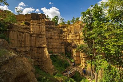 Ruins of temple against cloudy sky