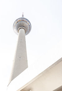 Low angle view of communications tower against sky