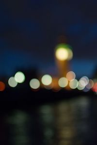 Defocused image of illuminated lights at night