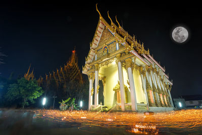 Low angle view of illuminated temple against sky at night